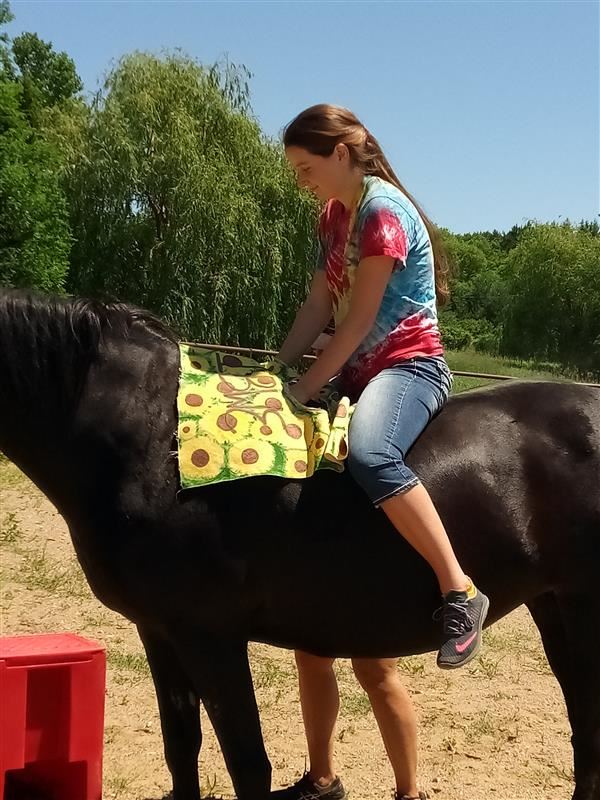 Sunka Wakan - student on horse 